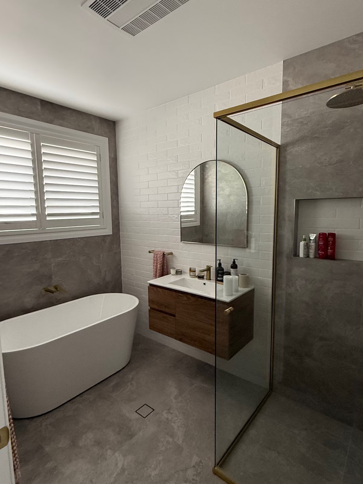 Main bathroom with freestanding bath and glass shower